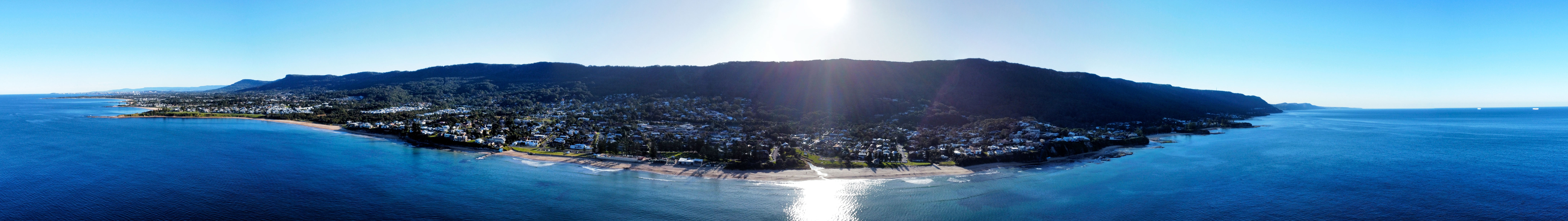 Aerial view of Thirroul beach looking south to suburbs of Wollongong